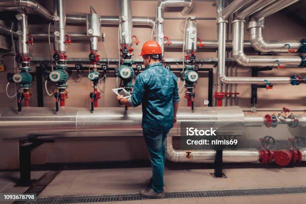 Stationary Engineer At Work Stock Photo - Download Image Now - Natural Gas, Industry, Repairing