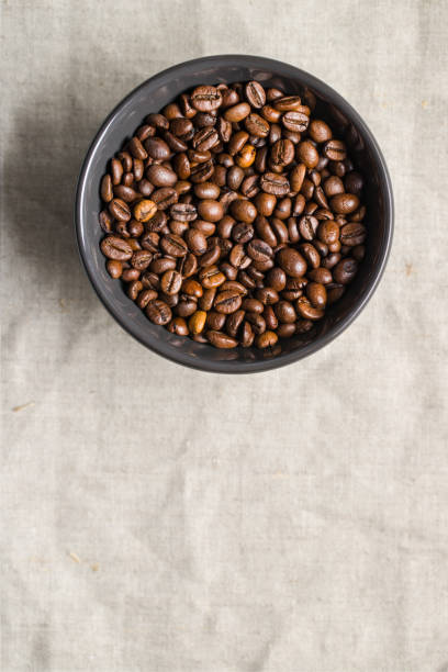 istock Roasted coffee beans in bowl. Top view. 1093679810