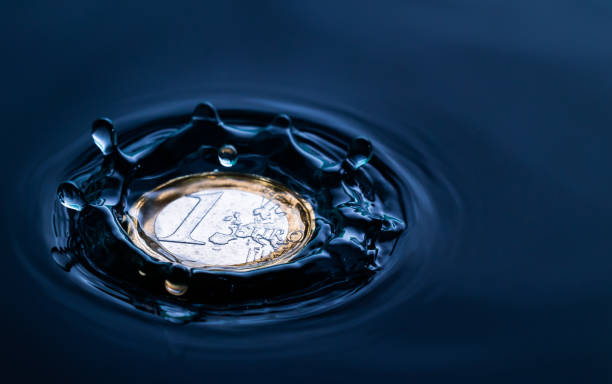 istock water drop impact on a coin 1093682150