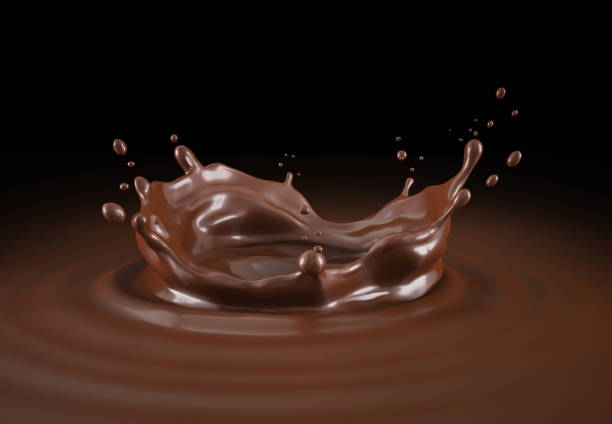 Liquid chocolate crown splash with ripples. Bird eye view. On black background. stock photo