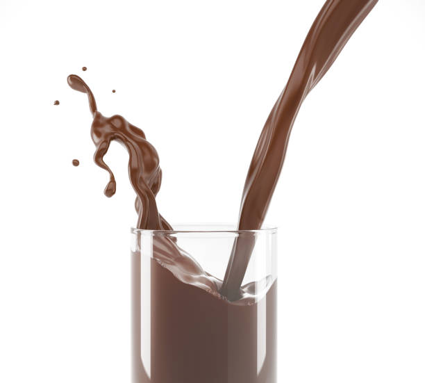 istock Pouring  liquid chocolate in a glass with splash. Close up side view. On white. 1093683544