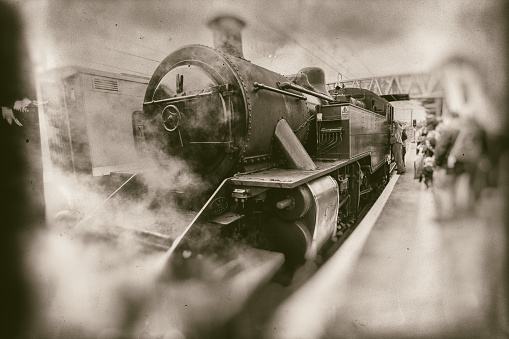 Coal burning K-36 steam locomotive moving toward camera on narrow gauge track.