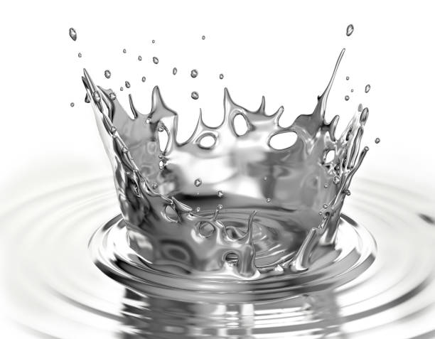 Liquid metal crown splash in liquid metal pool with ripples. stock photo