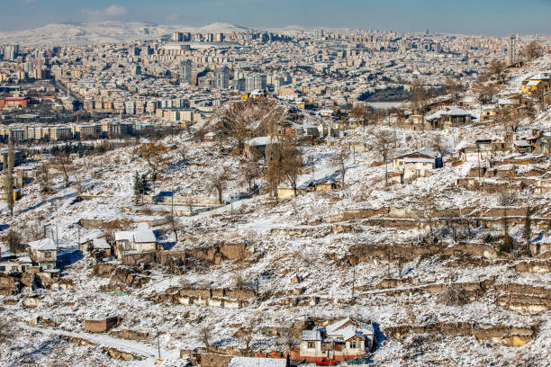 istock Suburb and Skyscrapers at winter with snow 1093685402