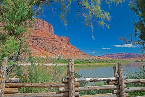 istock A rail fence frames a river running along red rock cliffs in Arches National Park. 1093686094