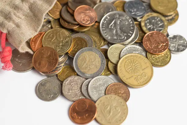 Euro coins pour out of the bag. Background of Euro coins money