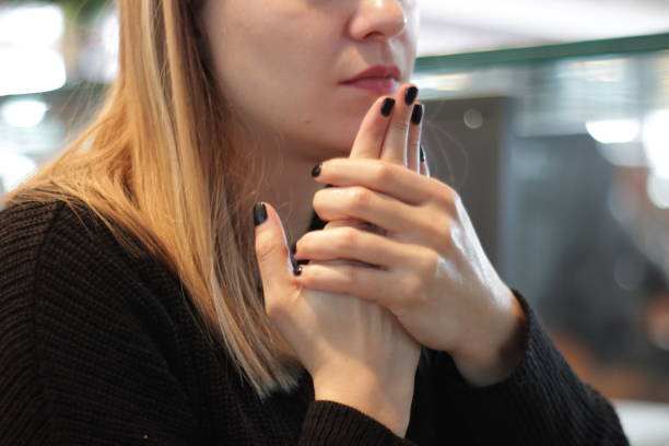 istock Young woman putting hand cream on her dry hands 1093694476