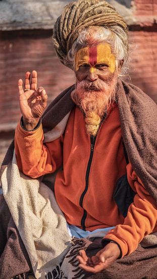 The cleric with a yellow beard in the temple