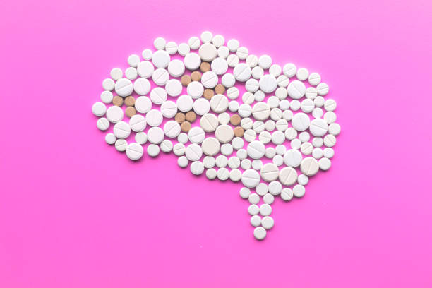 istock Brain made of pills on pink background. Top view. Multiple sclerosis day concept. 1093697394