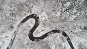 Aerial view of a curvy road in winter