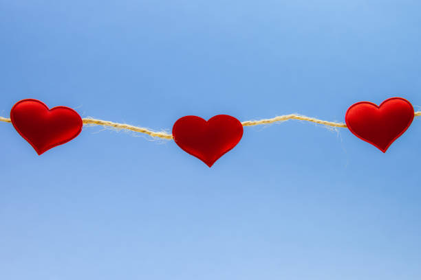 istock Red hearts on light blue background, strong love concept 1093698466