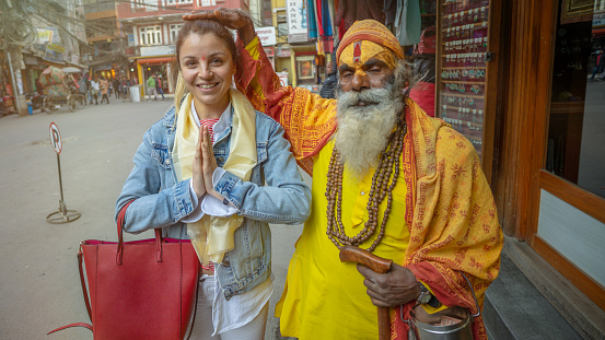 Buddhist man and blonde woman in kathmandu nepal