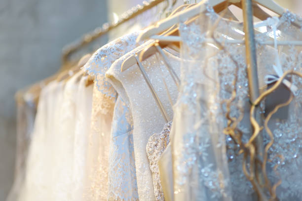 istock Few beautiful wedding dresses on a hanger. 1093700390
