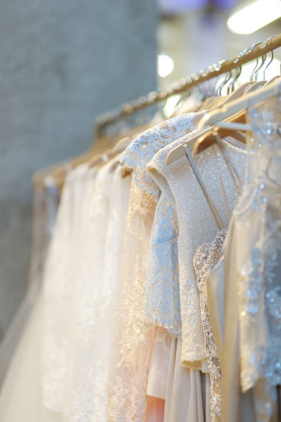 istock Few beautiful wedding dresses on a hanger. 1093700426