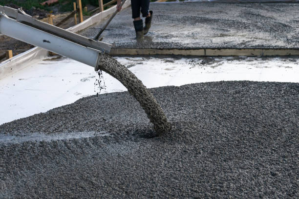istock Workers pour the Foundation for the construction of a residential building using mobile concrete mixers. 1093700486