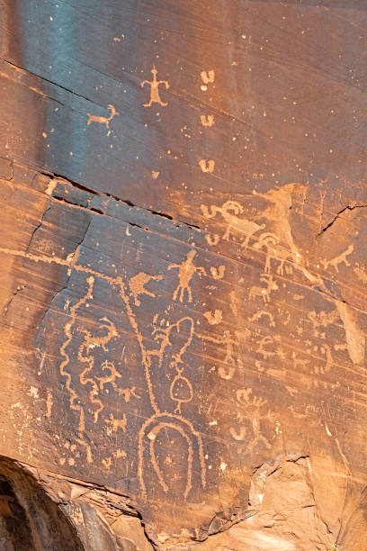 istock Vertical-famous rock art symbols on a stone wall. 1093703680