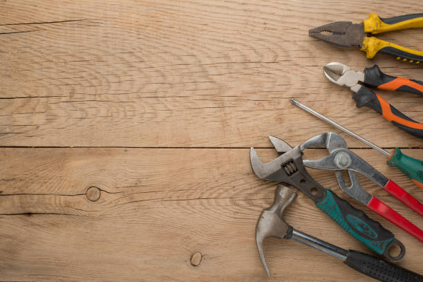 istock Working tools on a wooden rustic background. Top view with an empty place for inscription or advertising 1093711038