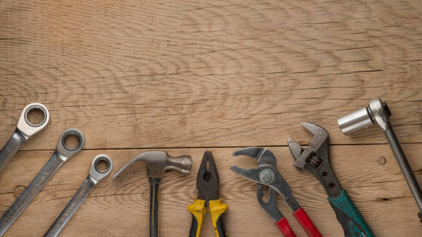 istock Working tools on a wooden rustic background. Top view with an empty place for inscription or advertising 1093711492