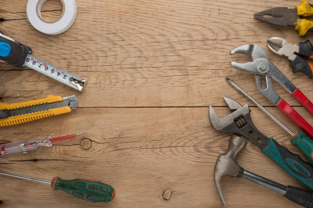 istock Working tools on a wooden rustic background. Top view with an empty place for inscription or advertising 1093713262