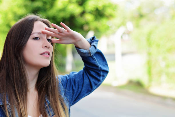 istock Young woman looking far with hand at her forehead. 1093717574