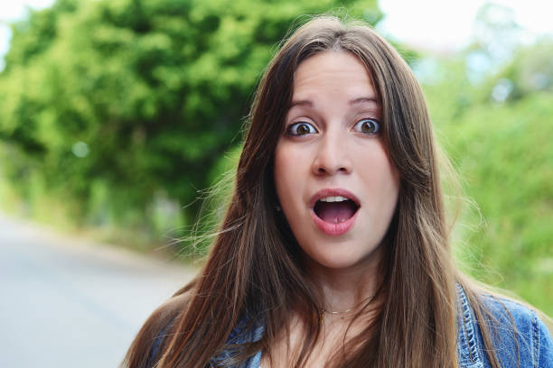 istock Young woman with surprised expression. Outdoor. 1093717596