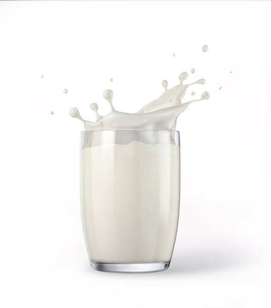 Glass full of fresh milk with splash. Isolated On white background. stock photo