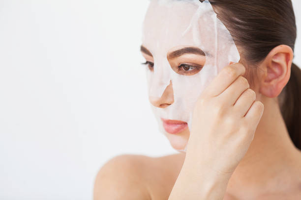 Skin Care. Beautiful Girl With Sheet Mask on Her Face Skin Care. Beautiful Girl With Sheet Mask on Her Face