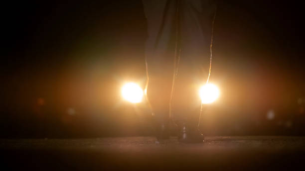 istock Man approaching to car with headlights on, night negotiations with bandits 1093725560