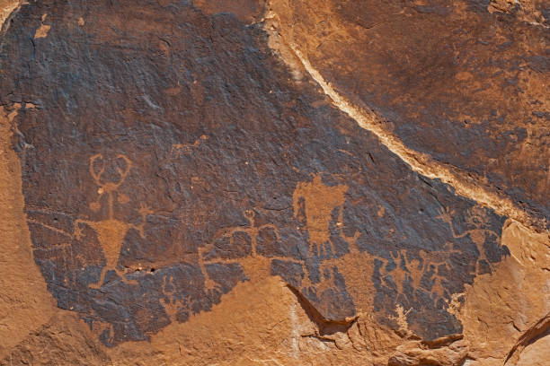 istock Rock art symbols decorate a rock wall in Utah. 1093726708