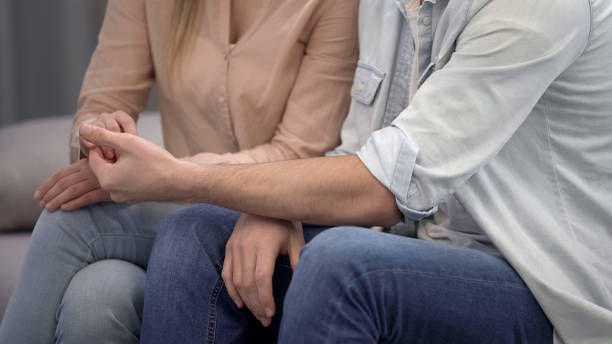 istock Young man gently holding female hand, love confession, trustful relations 1093728390