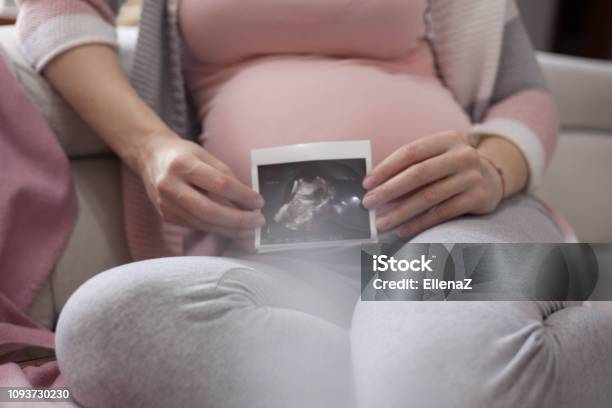 Mother Expecting A Baby Stock Photo - Download Image Now - Holding, Ultrasound, Women