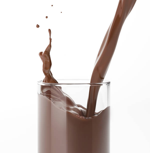 istock Pouring  liquid chocolate in a glass with splash. Close up side view. 1093730592