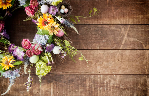istock Easter spring flower wreath on an old wood background 1093730866