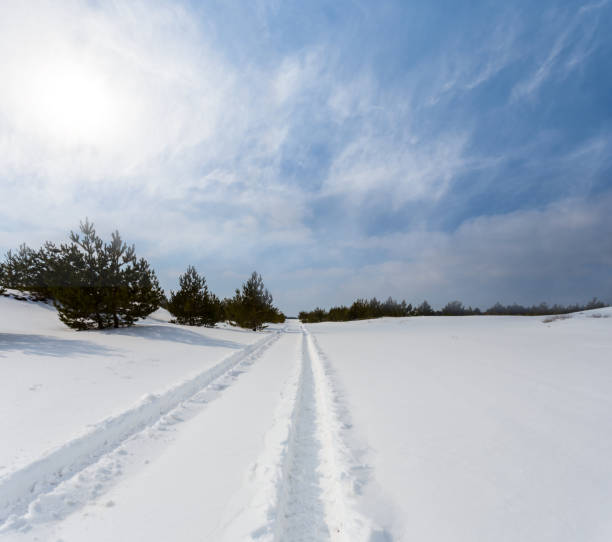 istock winter snowbound plain at the sunny day 1093732176