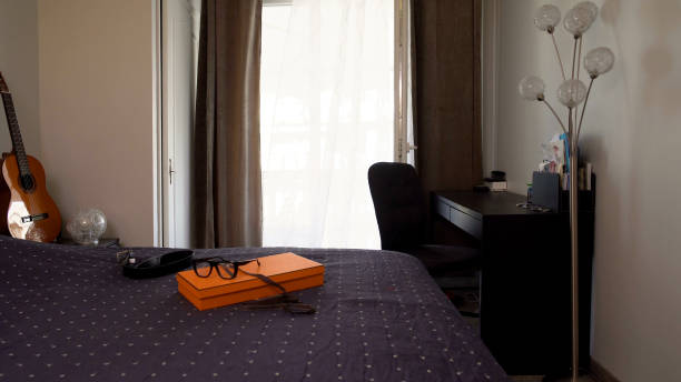 istock Empty students room with table, bed and guitar, comfortable apartment, home 1093734572