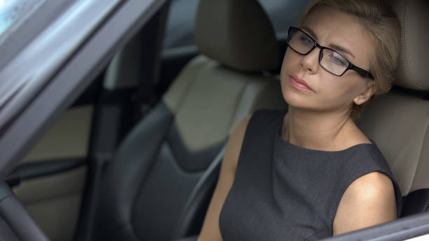 istock Pensive woman sitting in automobile and thinking about life problems, depression 1093735816