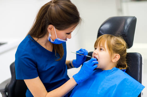istock Cute girl teeth checkup at dentist's office 1093736060