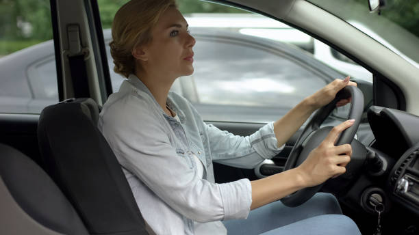 istock Female attentively looking at road, practicing driving on pre-licensing course 1093736778