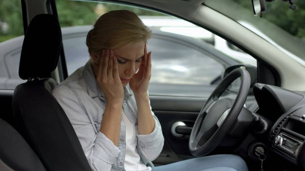 istock Blond female suffering from strong migraine, sitting in auto, headache disorder 1093736904