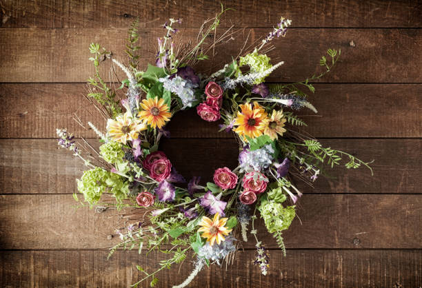 istock Easter spring flower wreath on an old wood background 1093737330