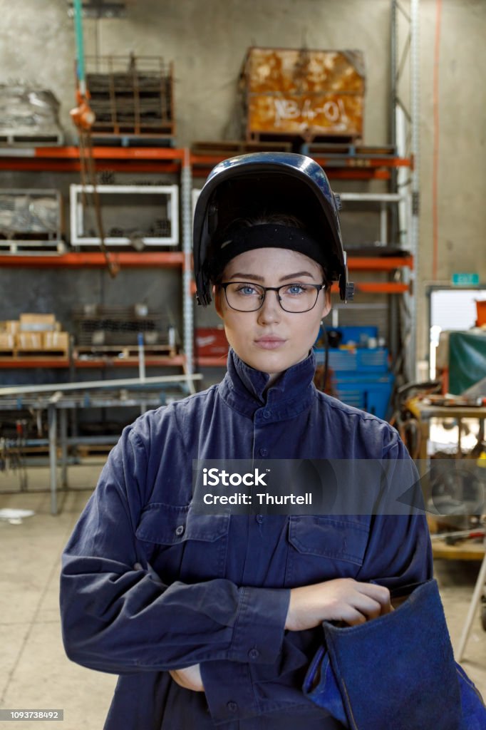 Portrait Of Female Welder Portrait Of Female Welder In Factory Wearing Protective Safety Gear 4K Resolution Stock Photo
