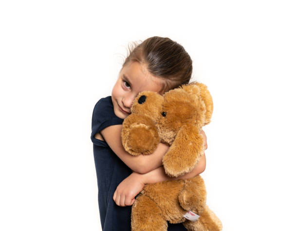istock Happy Girl Hugging Teddy Bear 1093752010