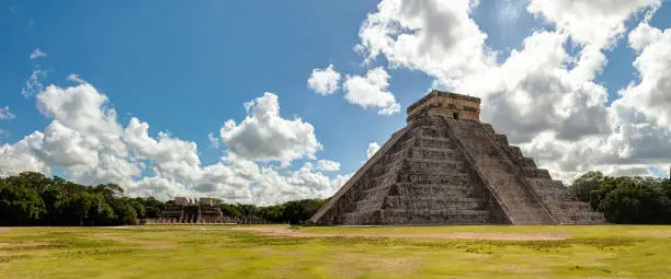 Chichén Itzá is the largest of the archaeological cities of the pre-Columbian Maya civilization in the Yucatan Peninsula of Mexico. It was granted World Heritage Site status in 1988 by UNESCO World Heritage Site and was recently selected as one of the New Seven Wonders of the World. The Pyramid of Kukulcan is the most famous landmark of Chichen Itza. This was a temple-pyramid dedicated to the Feathered Serpent God, Kukulcan. Sculptures of the Feathered Serpents run down the sides of the northern staircase, and are set off by shadows from the corner tiers on the Spring and Fall equinox