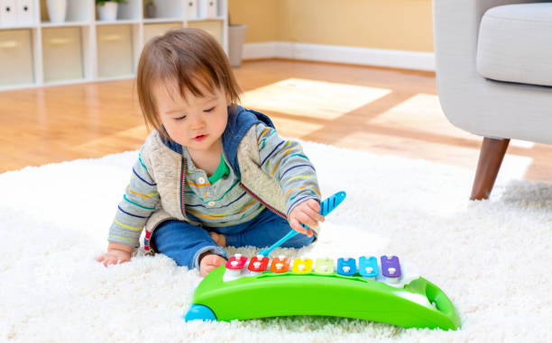 istock Toddler boy playing a musical instrument 1093767002