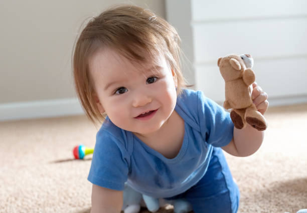 istock Happy boy playing with his toys 1093767070