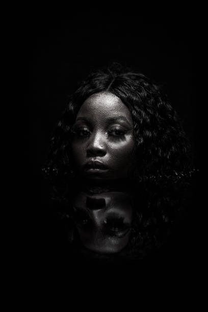 istock African Woman In Dark Water 1093772442