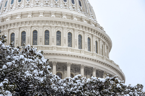 Capitol building, The United States Congress covered with snow in winter time and Capitol hill area covered with snow