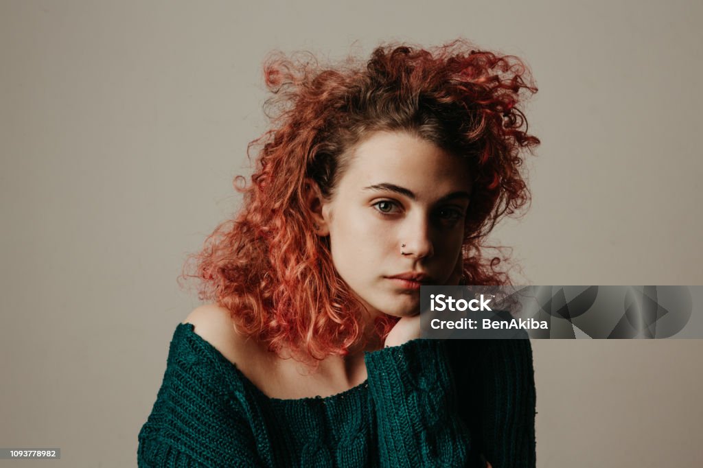 Gen Z Girl Portrait of a redhead girl. Studio shot. Teenage Girls Stock Photo