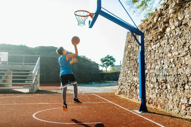 istock Young basketball player shoot 1093789734