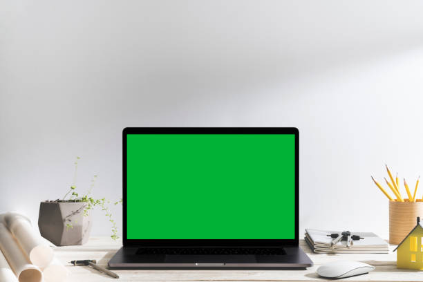istock Chroma key green screen laptop on table. 1093794486